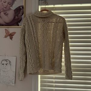 See through turtle neck sweater